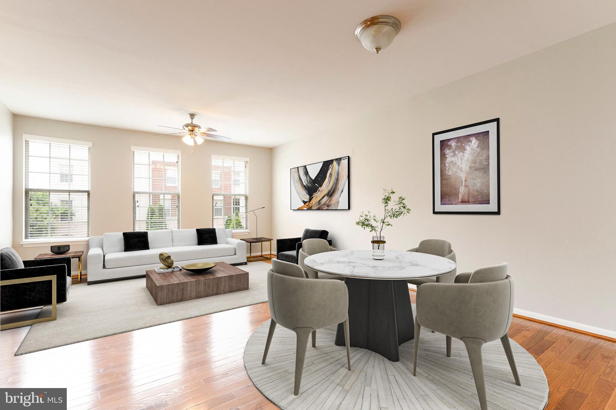 22672 Flowing Spring Square Brambleton, VA 20148 - Photo 2 of 35 a view of a dining room with furniture window and wooden floor