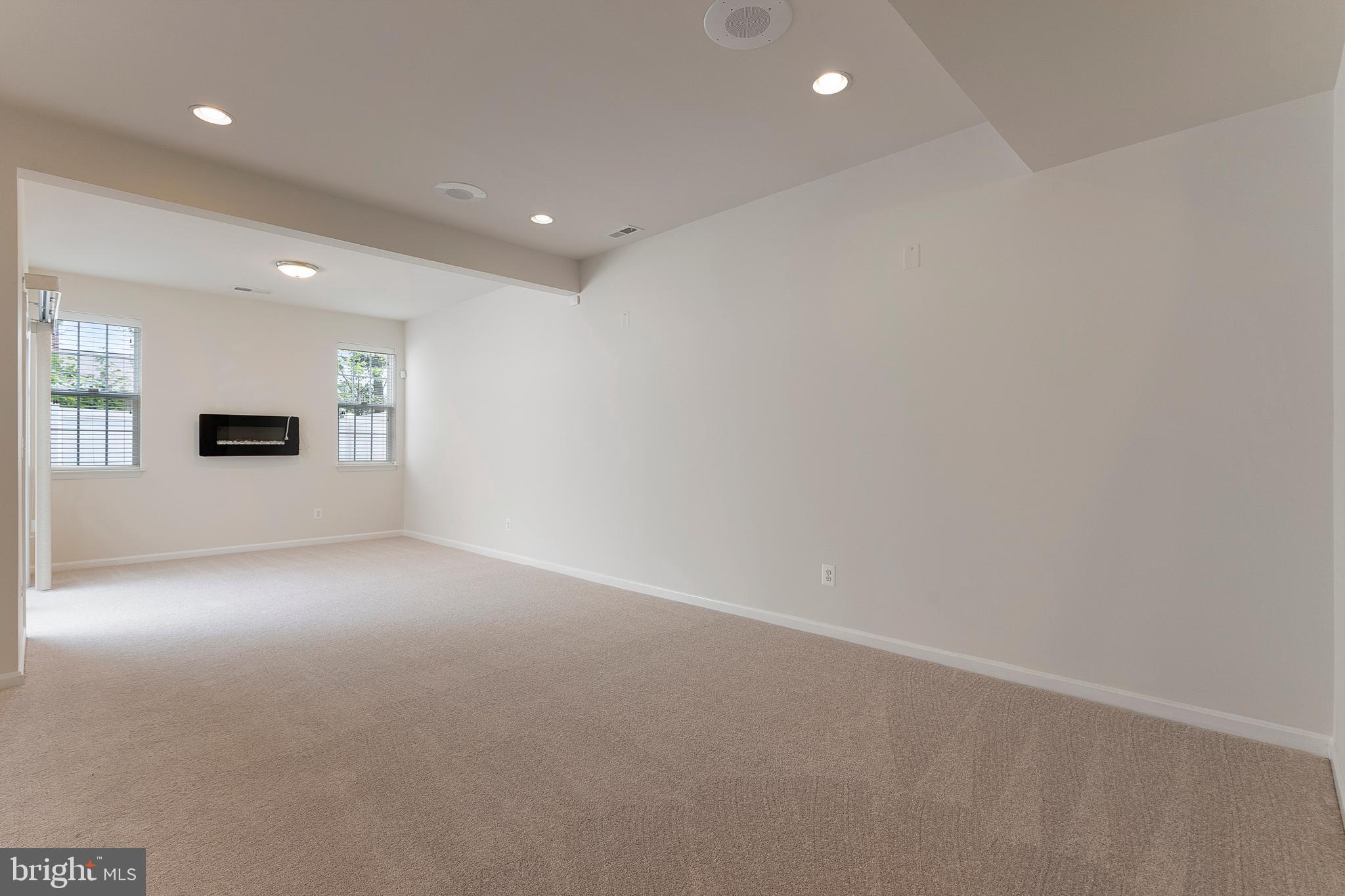 22672 Flowing Spring Square Brambleton, VA 20148 - Photo 22 of 35 a view of an empty room with a stove