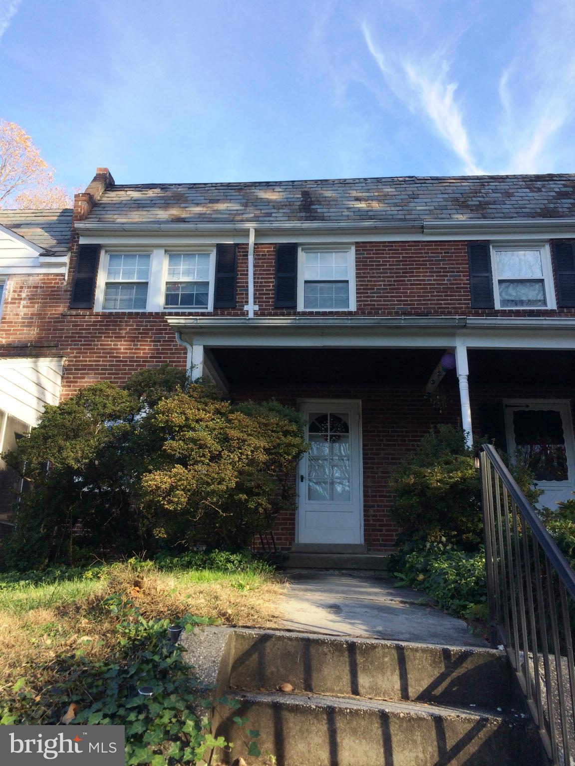 55 Burkleigh Road Towson, MD 21286 - Photo 1 of 5 a front view of a house with a yard