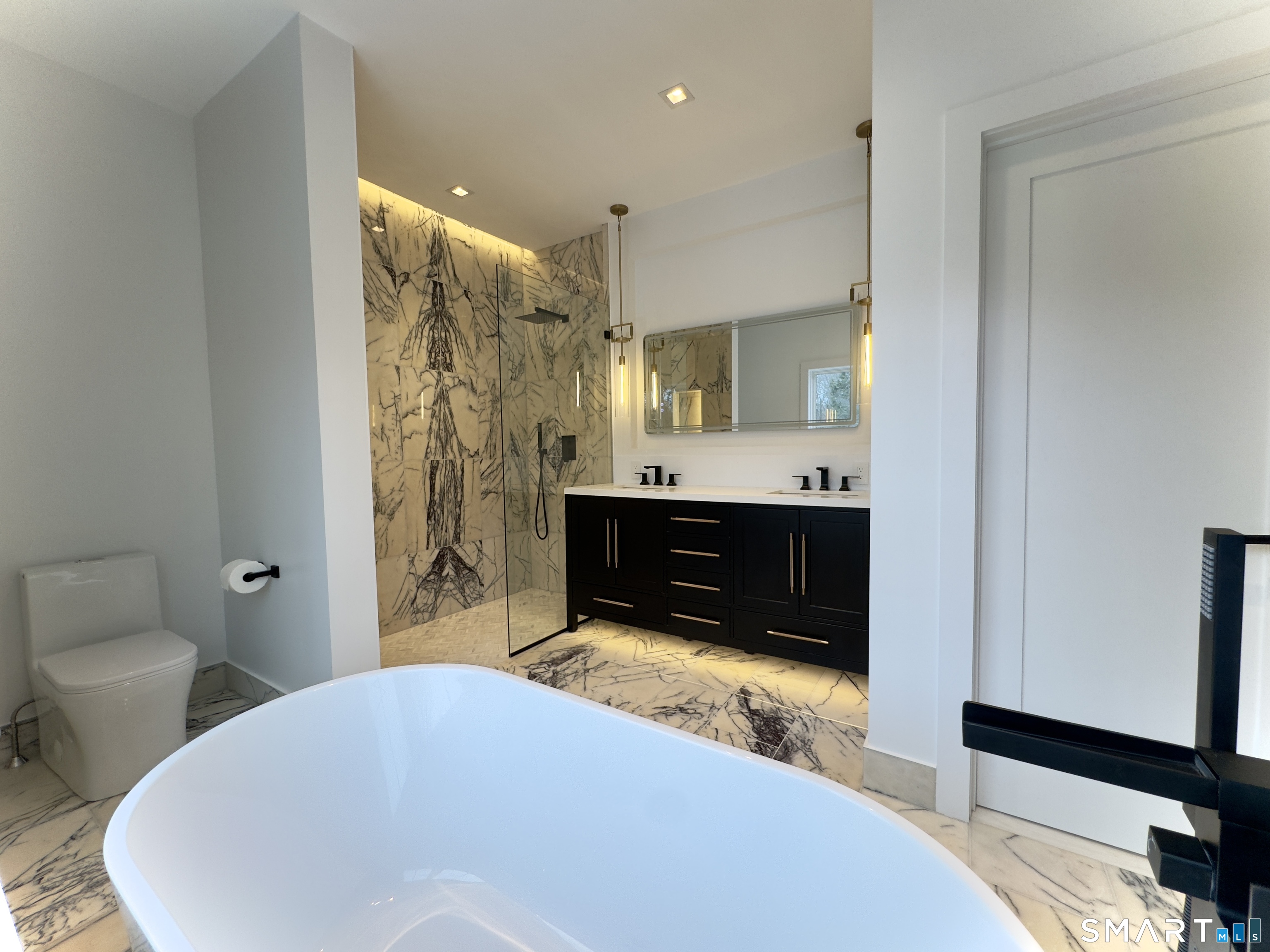 173 Belltown Road Stamford, CT 06905 - Photo 19 of 42 a bathroom with a sink and a mirror