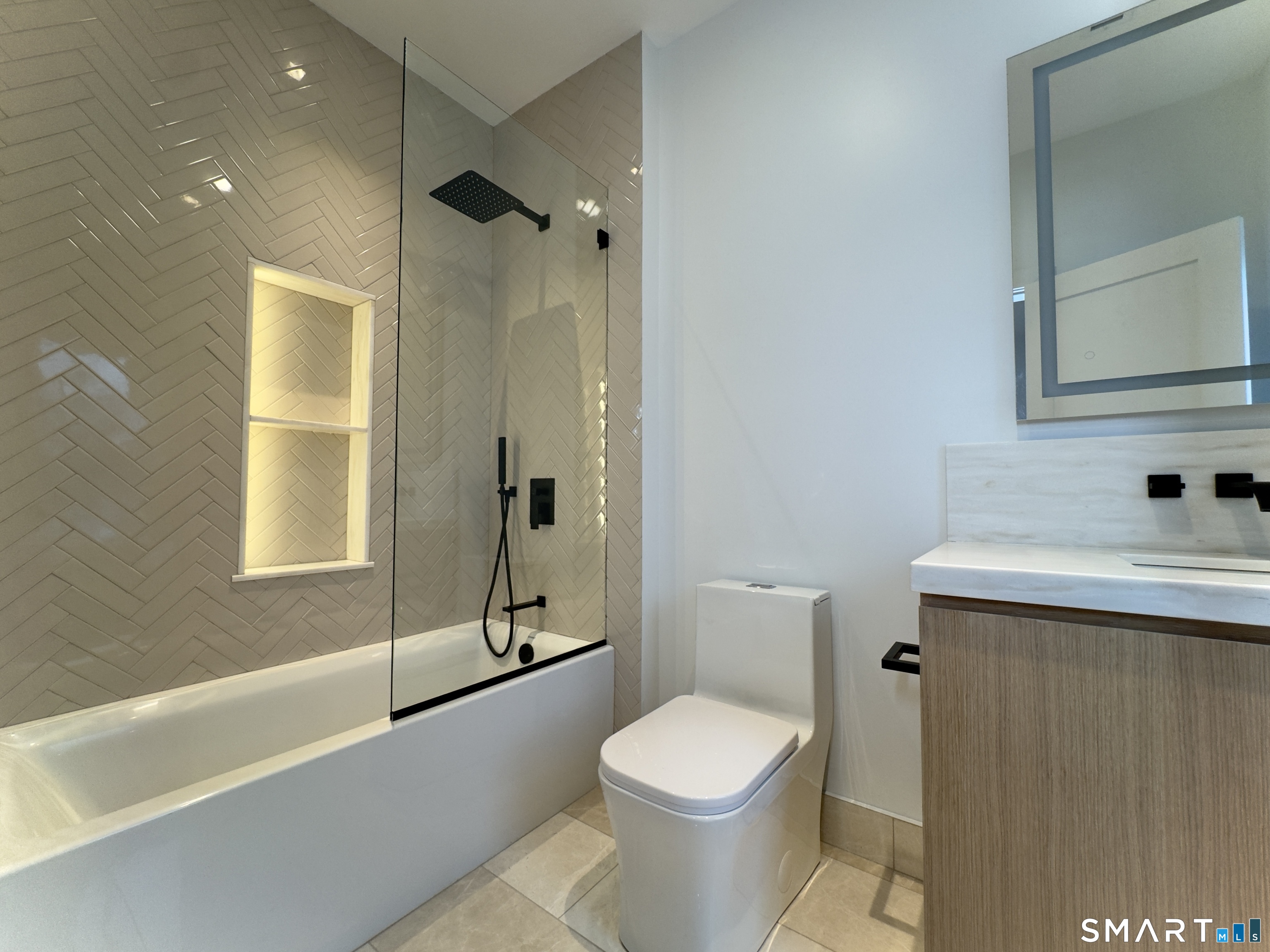 173 Belltown Road Stamford, CT 06905 - Photo 24 of 42 a bathroom with a sink a toilet and shower