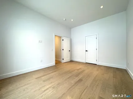 an empty room with wooden floor