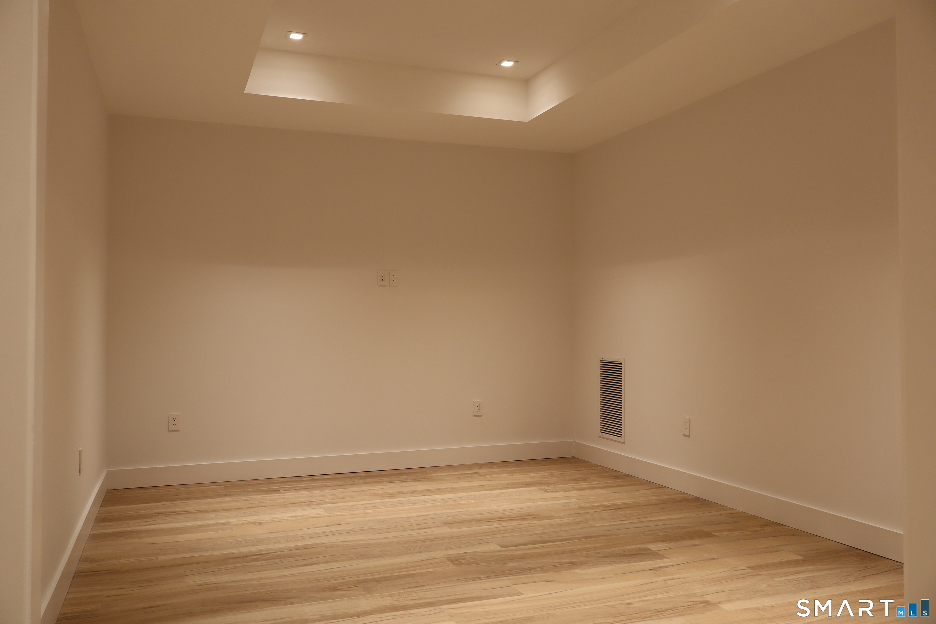 173 Belltown Road Stamford, CT 06905 - Photo 38 of 42 a view of an empty room with wooden floor and a window