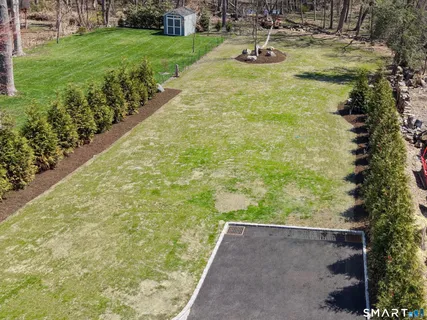 a view of a yard with an outdoor space