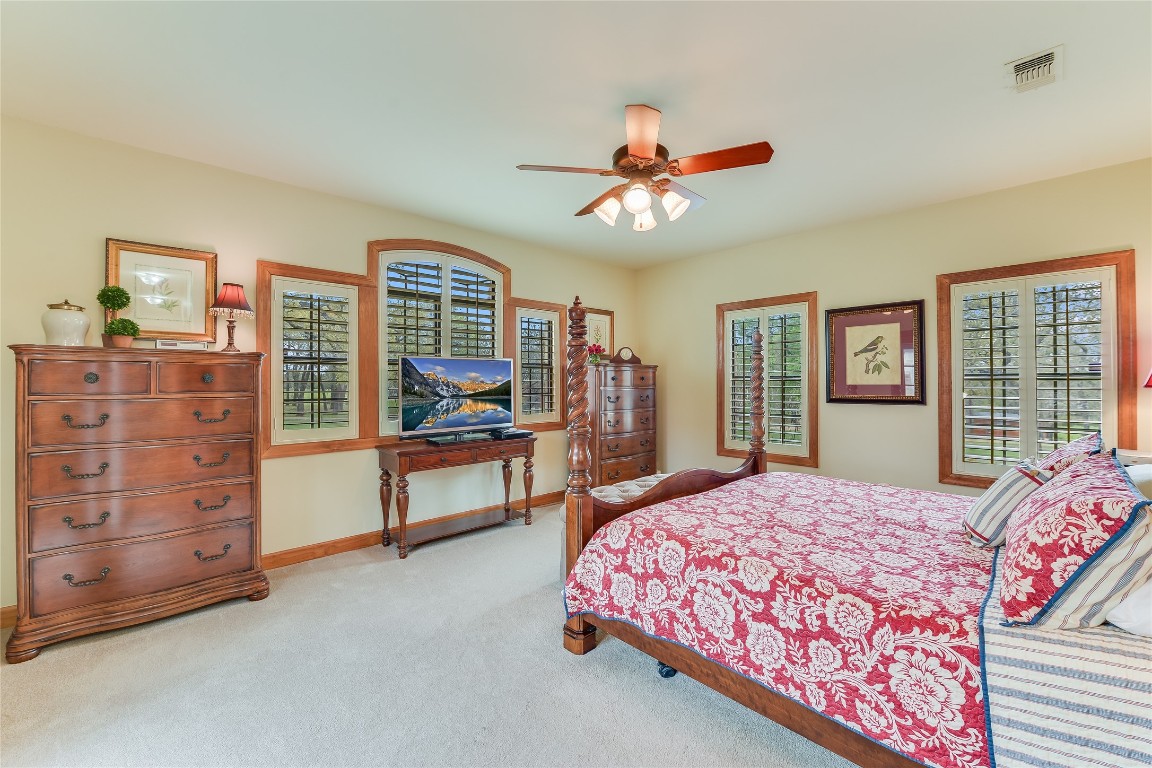 363 Paint Creek S Road, Unit A Paige, TX 78659 - Photo 16 of 40 a spacious bedroom with a bed a dresser and a window