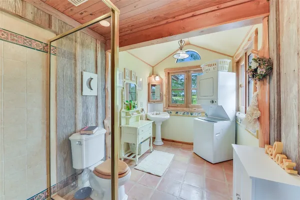 a very nice looking room with a large window and chandelier