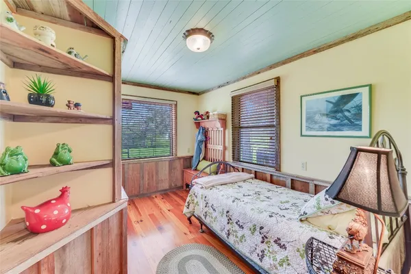 a bed room with a bed and a window