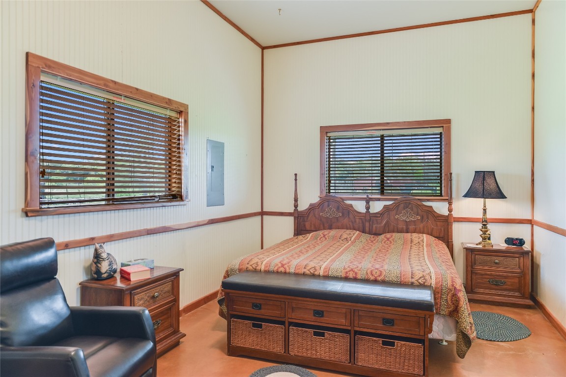 363 Paint Creek S Road, Unit A Paige, TX 78659 - Photo 38 of 40 a bedroom with a bed and wooden floor