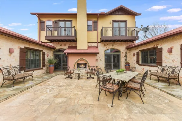 a view of a house with patio outdoor seating