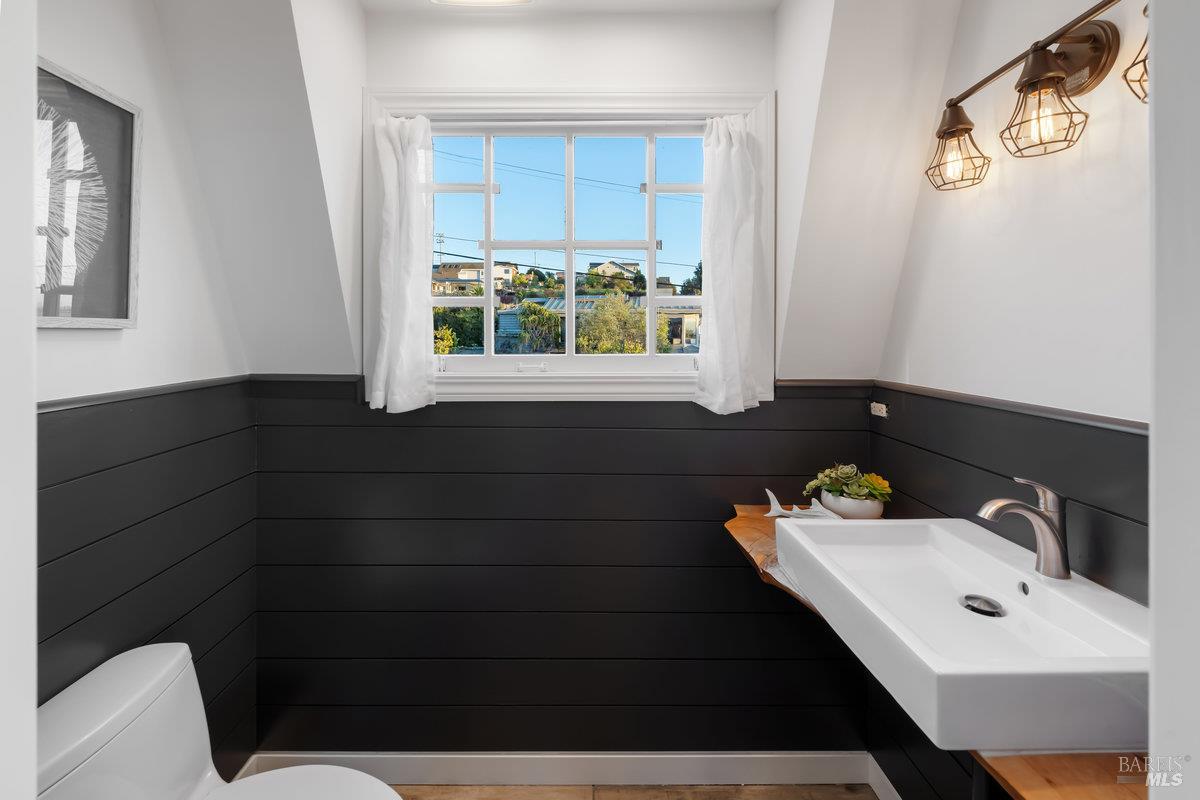 700 Ocean Avenue Point Richmond, CA 94801 - Photo 30 of 95 a bathroom with a sink and a window