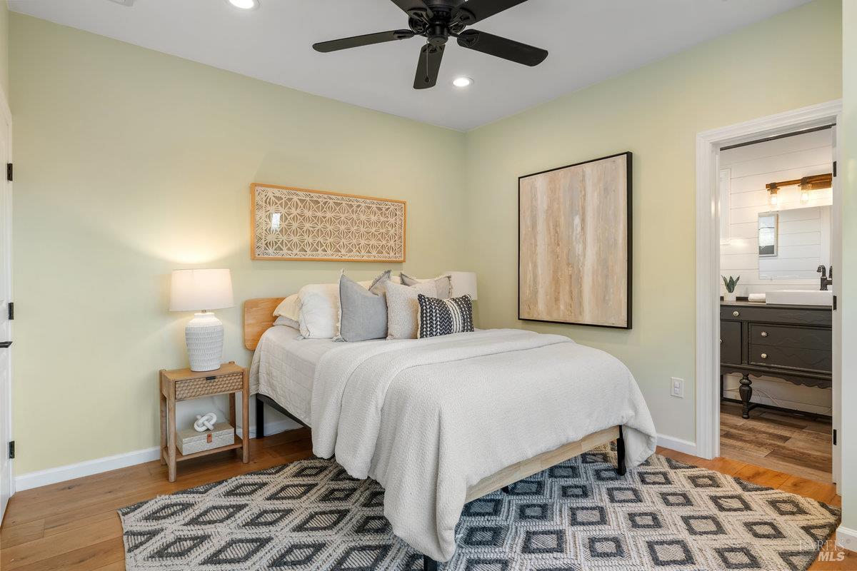 700 Ocean Avenue Point Richmond, CA 94801 - Photo 35 of 95 a bedroom with a bed and wooden floor