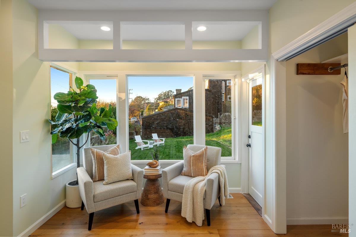 700 Ocean Avenue Point Richmond, CA 94801 - Photo 36 of 95 a living room with furniture and a large window with garden view