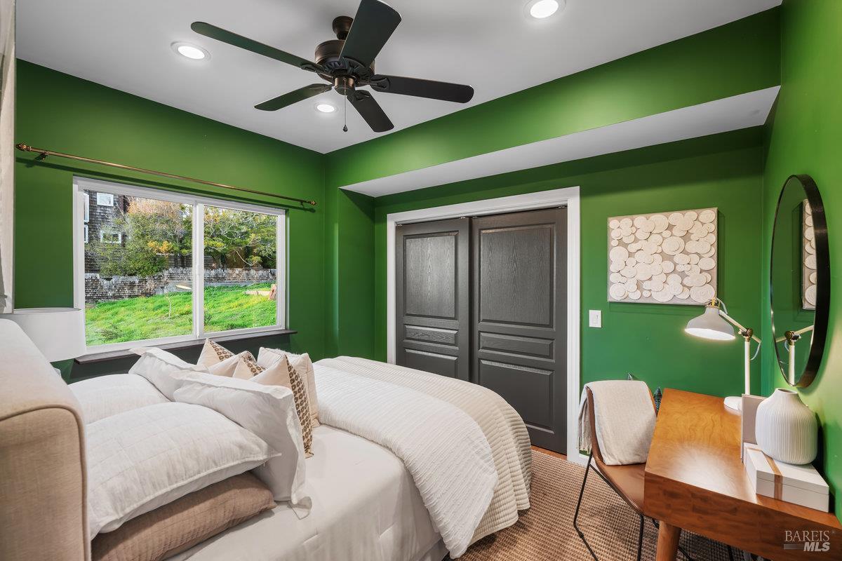 700 Ocean Avenue Point Richmond, CA 94801 - Photo 48 of 95 a bed room with a bed and a chair