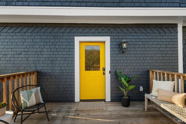 a view of entryway with furniture and wooden floor