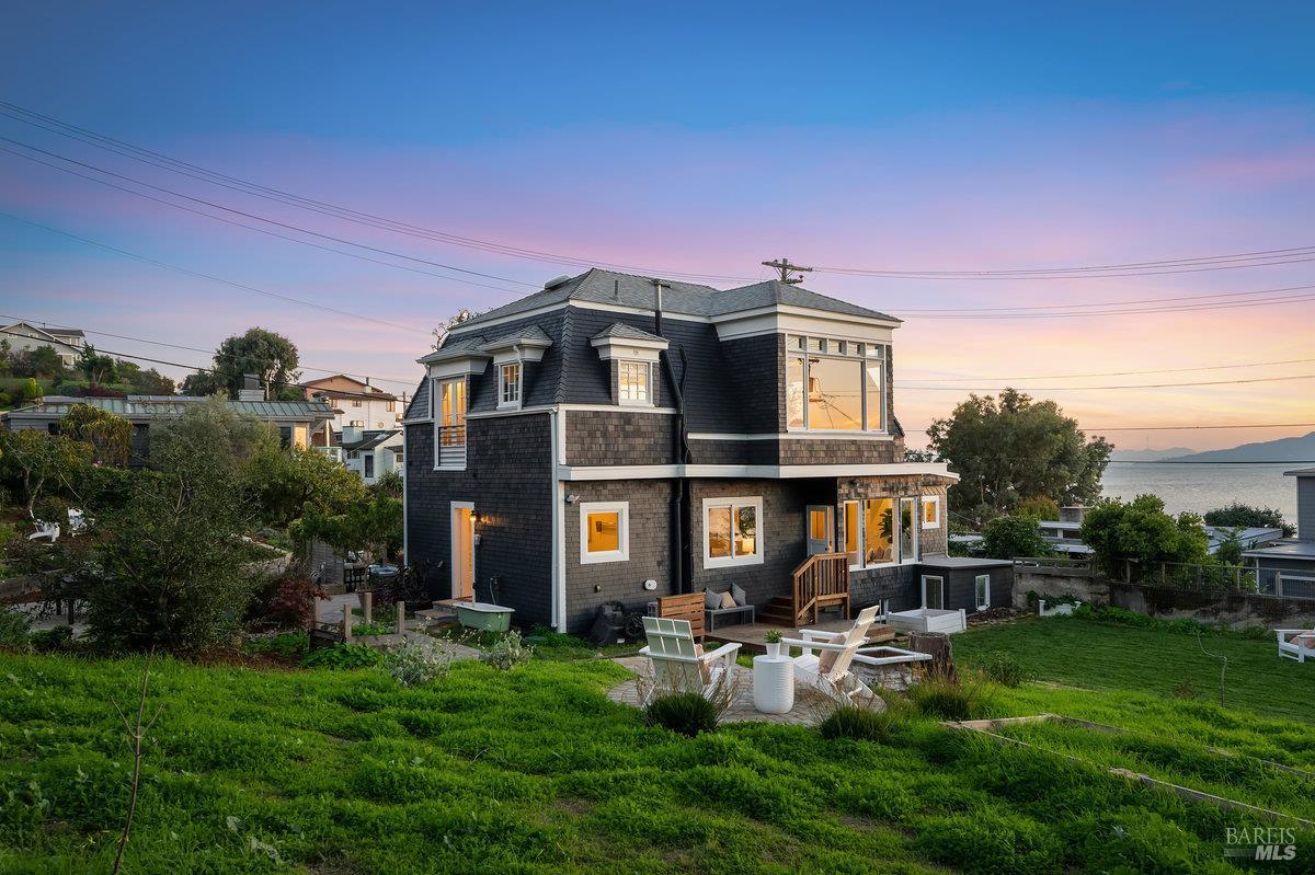 700 Ocean Avenue Point Richmond, CA 94801 - Photo 70 of 95 a front view of a house with a yard table and chairs