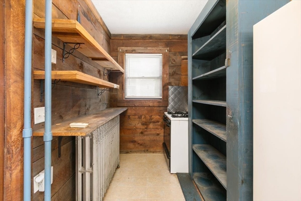 98 Webster Street Haverhill, MA 01830 - Photo 16 of 42 a view of walk in closet with empty racks