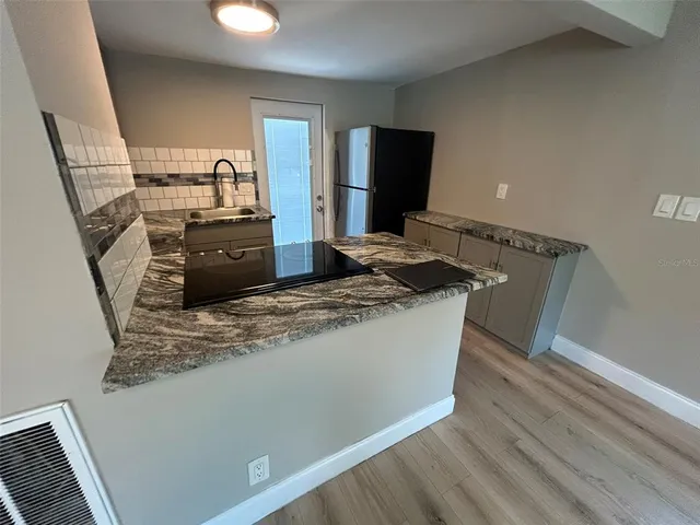 a view of kitchen island wooden floor