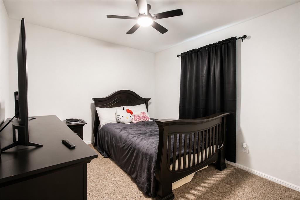 3204 Quiet Valley Road Fort Worth, TX 76123 - Photo 6 of 29 a bedroom with a bed and a window