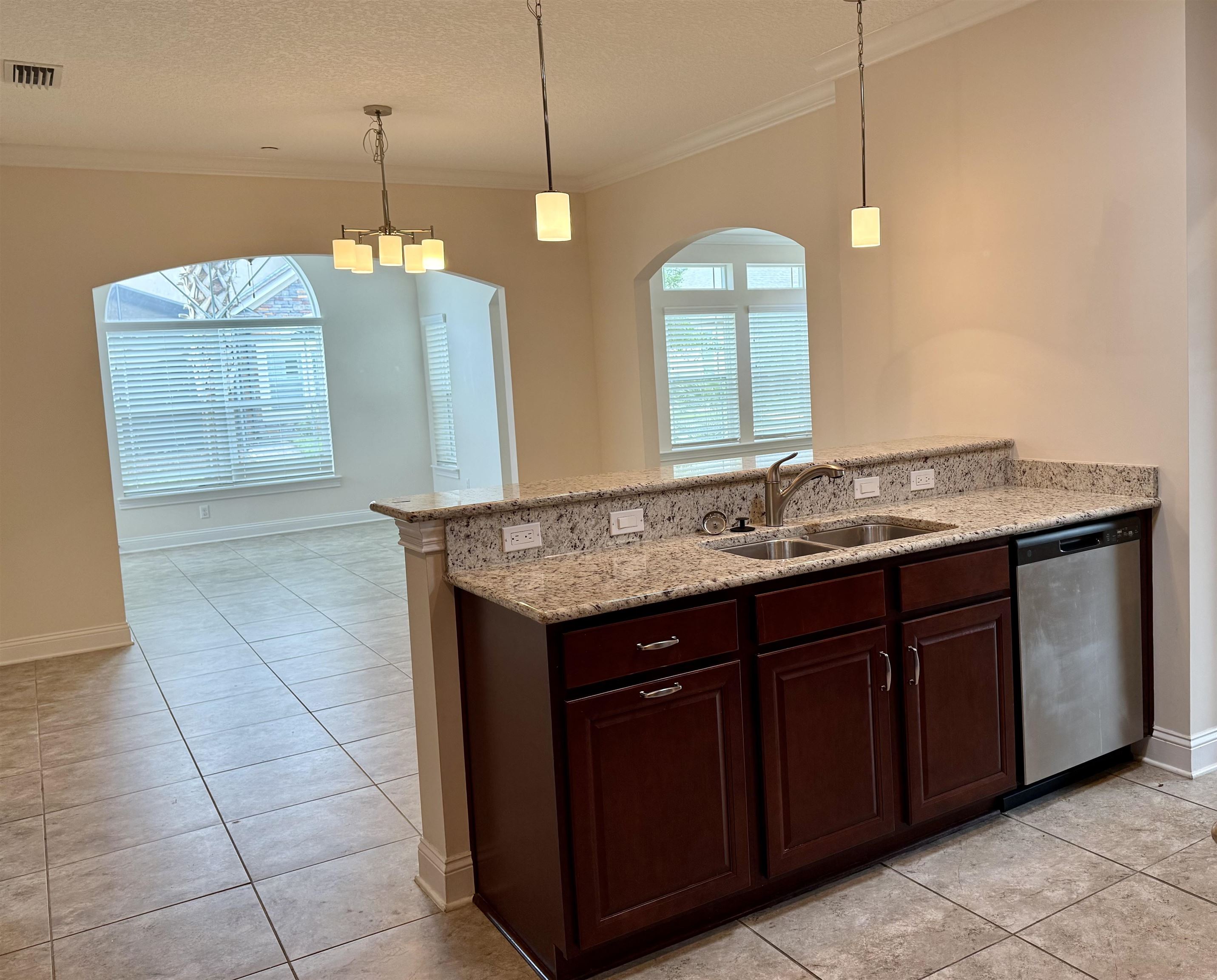 71 Utina Way St. Augustine, FL 32084 - Photo 15 of 37 a bathroom with a granite countertop sink a toilet and a mirror