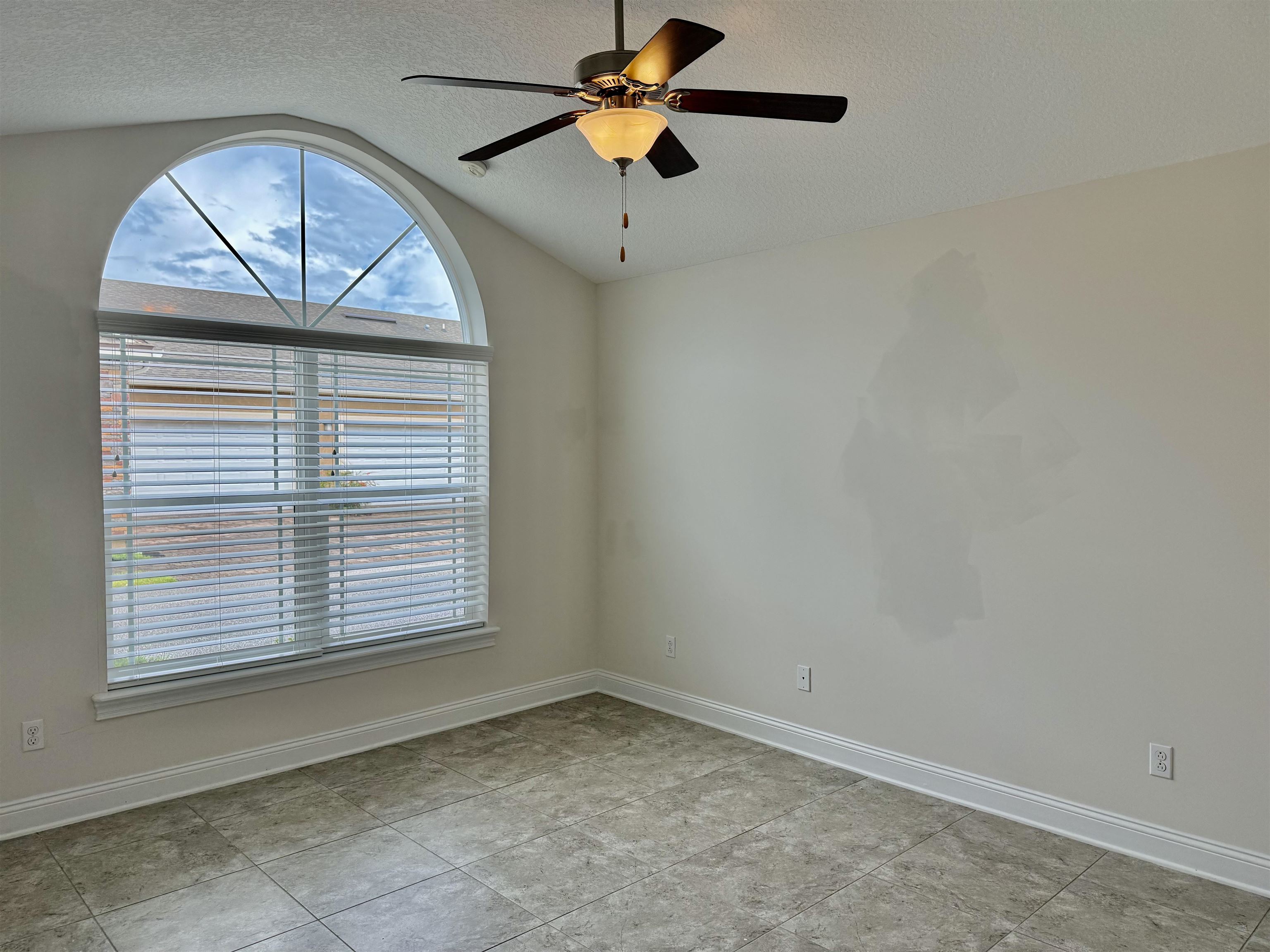 71 Utina Way St. Augustine, FL 32084 - Photo 16 of 37 an empty room with a window and a ceiling fan