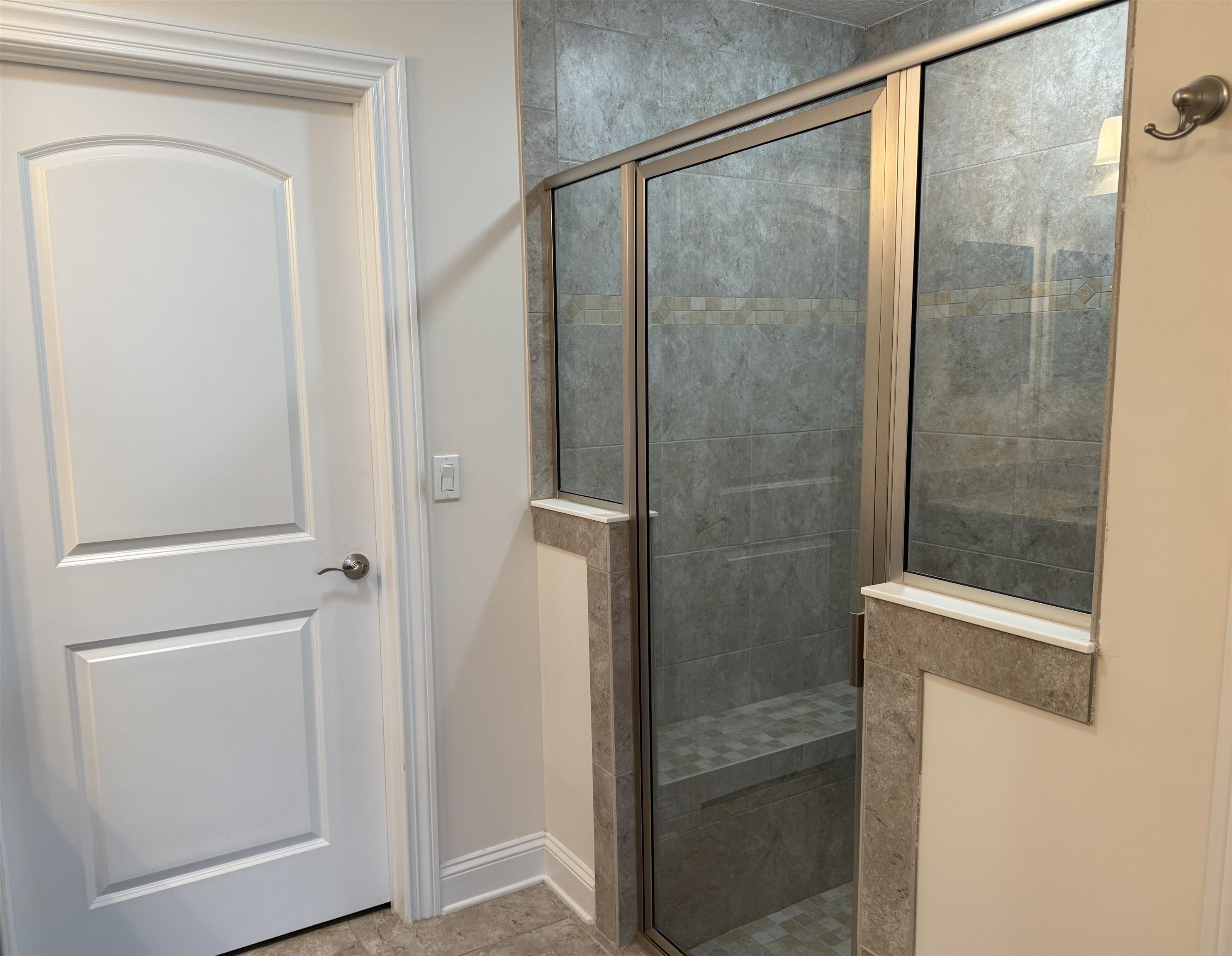 71 Utina Way St. Augustine, FL 32084 - Photo 19 of 37 a bathroom with a glass shower door