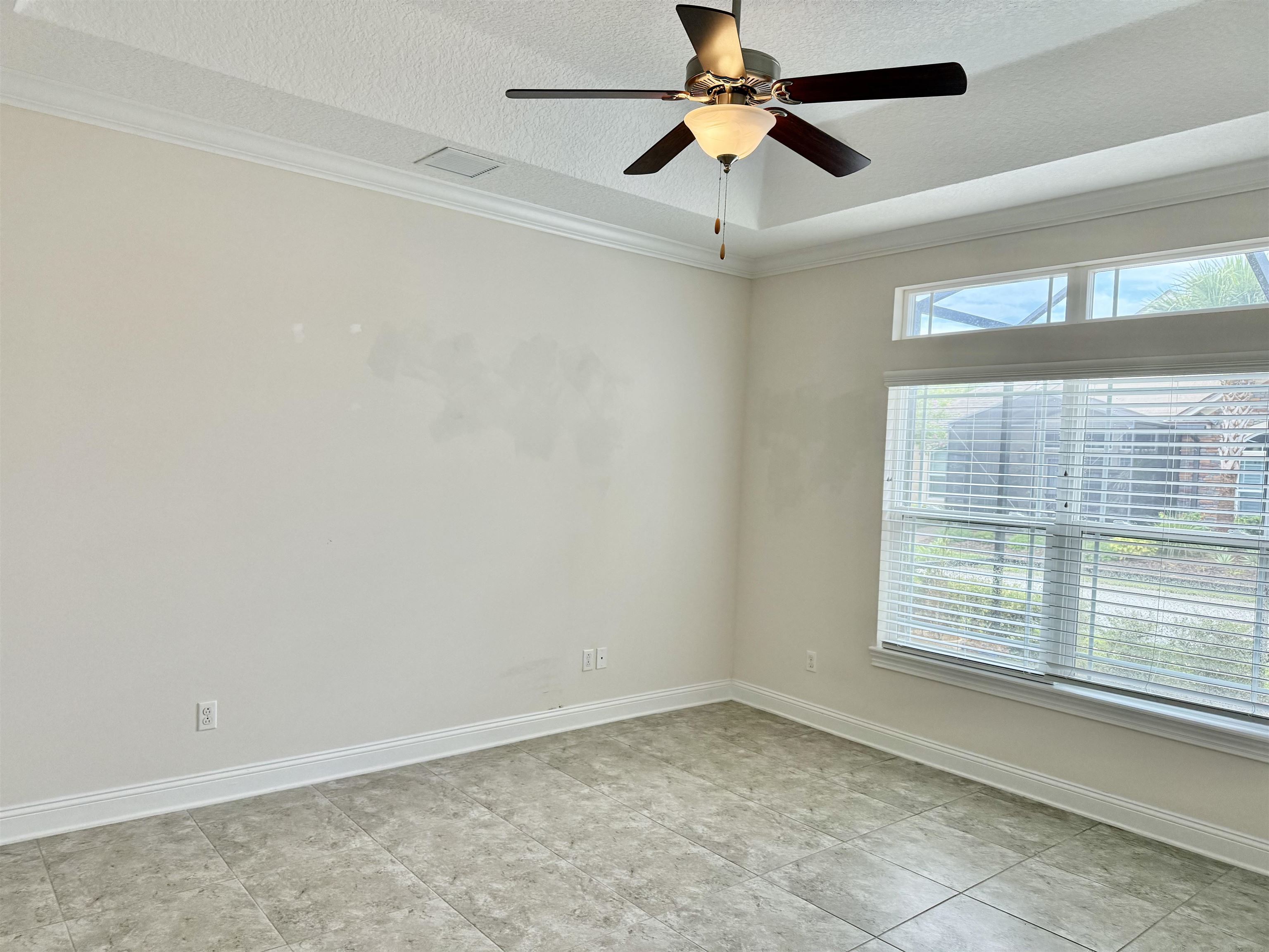 71 Utina Way St. Augustine, FL 32084 - Photo 24 of 37 an empty room with a window and a fan