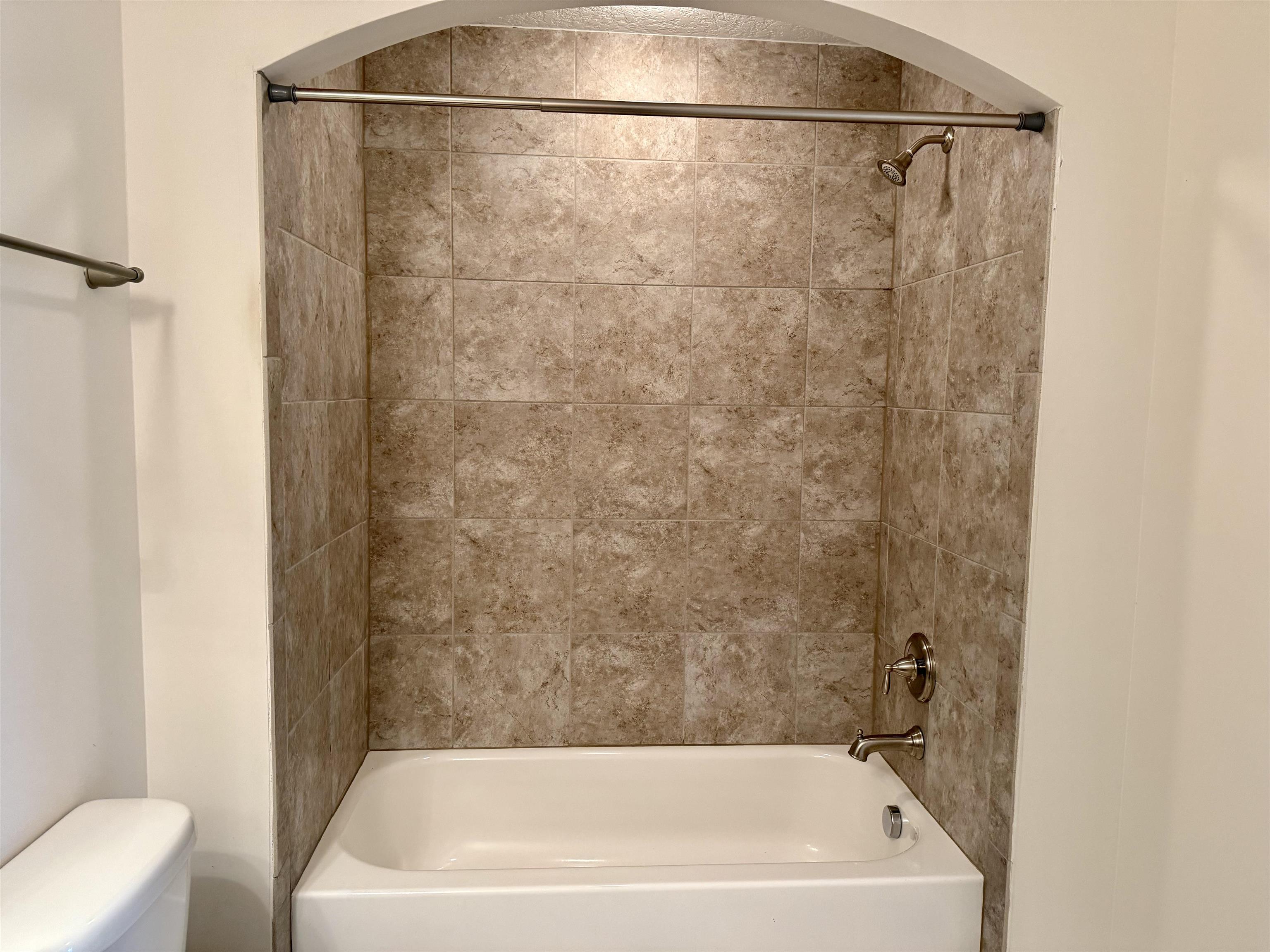 71 Utina Way St. Augustine, FL 32084 - Photo 26 of 37 a bathroom with a bathtub and a shower