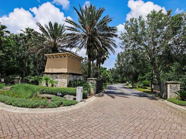 71 Utina Way St. Augustine, FL 32084 - Photo 30 of 37 a sign board with flower plants and wooden fence