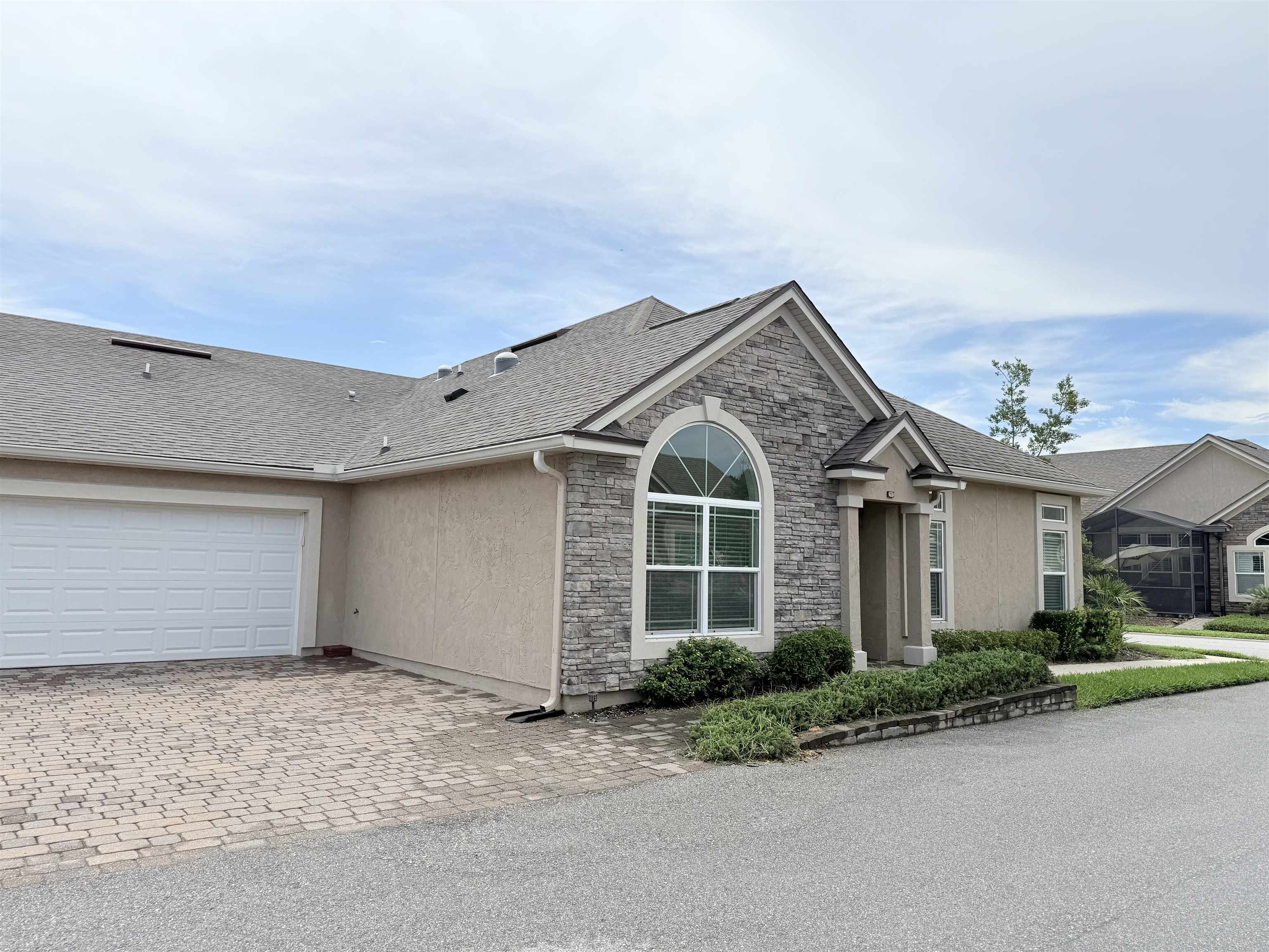 71 Utina Way St. Augustine, FL 32084 - Photo 3 of 37 a view of a white house next to a yard