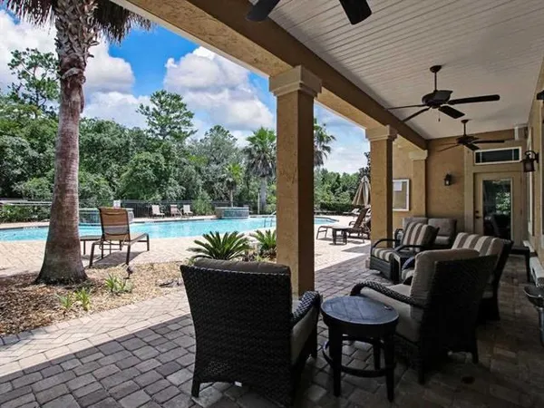 a patio with table and chairs