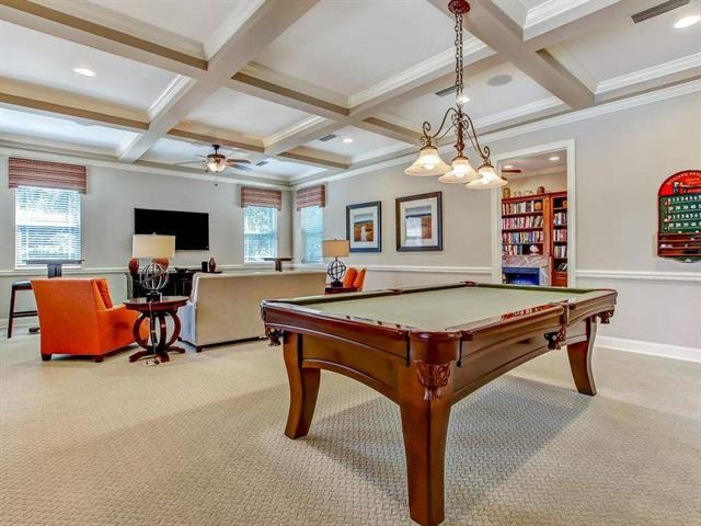 71 Utina Way St. Augustine, FL 32084 - Photo 37 of 37 a living room with pool table furniture a flat screen tv and a chandelier