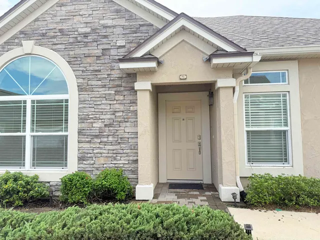 a front view of a house with a porch