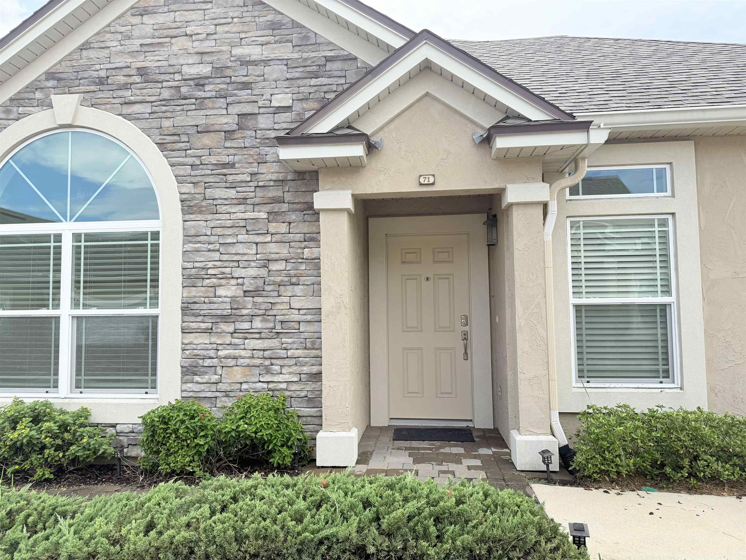 71 Utina Way St. Augustine, FL 32084 - Photo 4 of 37 a front view of a house with a porch