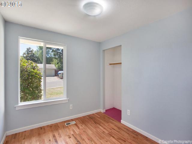 19705 Southwest Prospect Lane Aloha, OR 97078 - Photo 11 of 16 a view of a room with wooden floor and a window