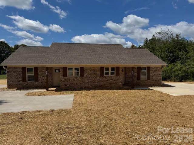 149 Camp Creek Road, Unit 103 Iron Station, NC 28080 - Photo 2 of 12 a front view of a house with a yard
