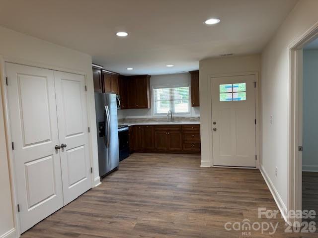 149 Camp Creek Road, Unit 103 Iron Station, NC 28080 - Photo 4 of 12 a view of kitchen with wooden floor electronic appliances and window