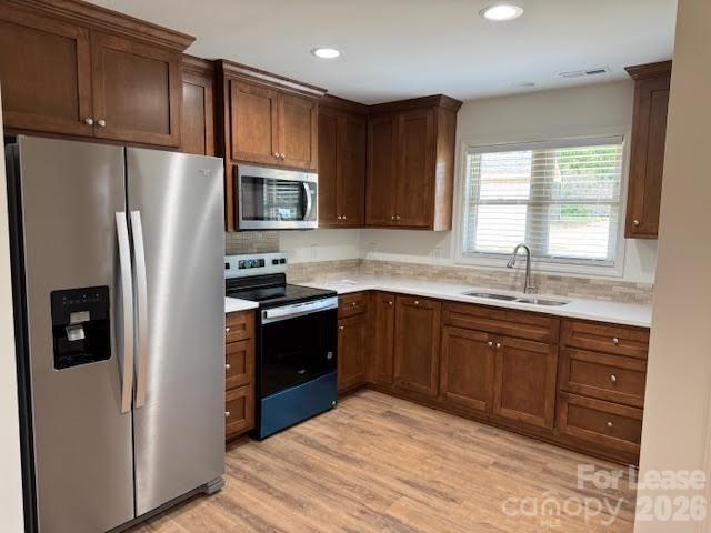 149 Camp Creek Road, Unit 103 Iron Station, NC 28080 - Photo 5 of 12 a kitchen with stainless steel appliances granite countertop a refrigerator stove and sink