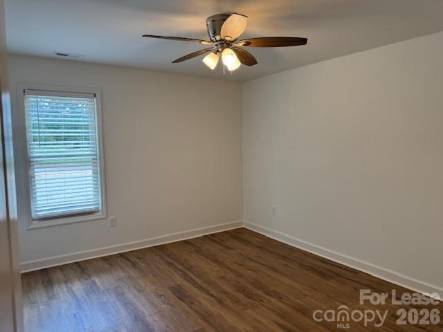 149 Camp Creek Road, Unit 103 Iron Station, NC 28080 - Photo 6 of 12 wooden floor in an empty room with a window