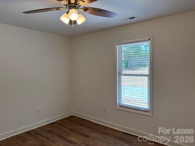 149 Camp Creek Road, Unit 103 Iron Station, NC 28080 - Photo 8 of 12 an empty room with wooden floor and windows