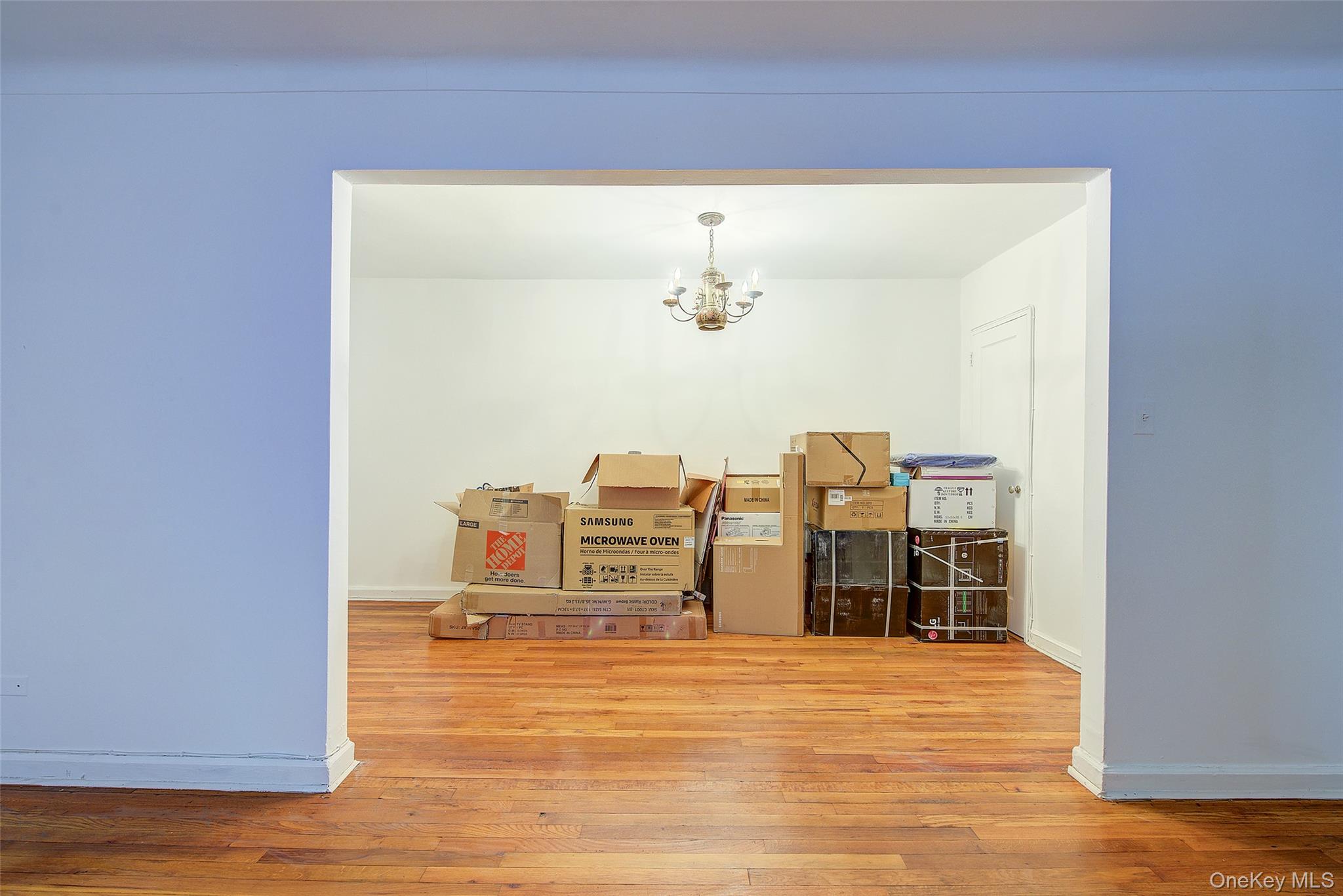 67-12 Yellowstone Boulevard, Unit D9 Queens, NY 11375 - Photo 11 of 36 a view of a room with wooden floor