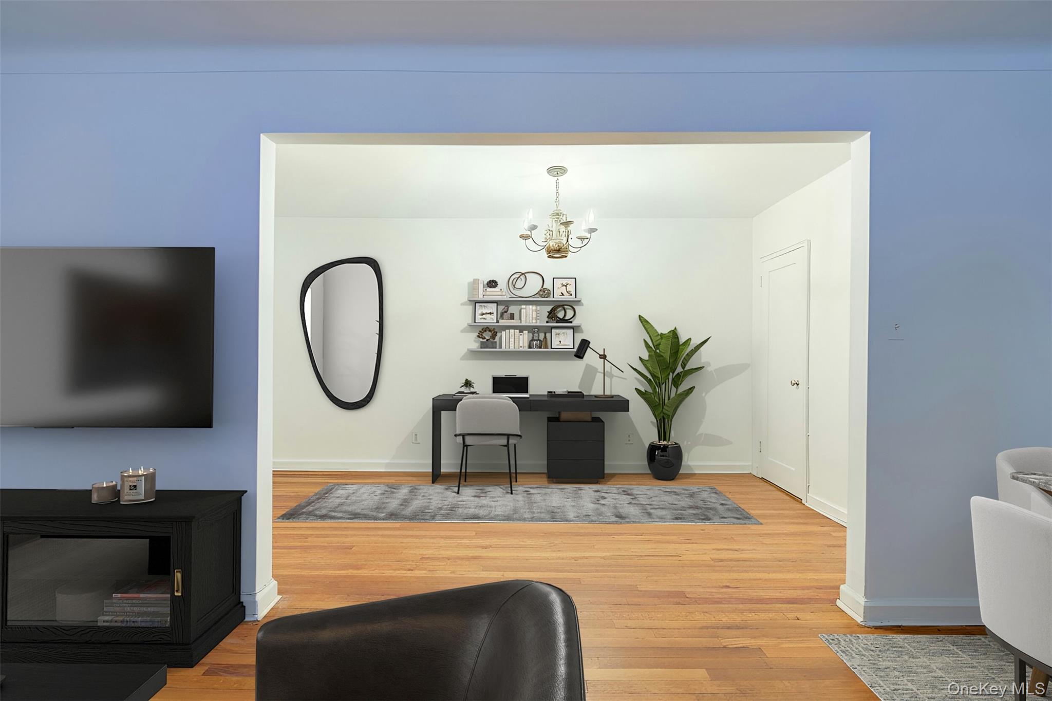 67-12 Yellowstone Boulevard, Unit D9 Queens, NY 11375 - Photo 13 of 36 a living room with furniture and a flat screen tv