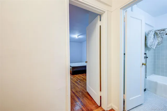 a view of a bathroom from a corridor