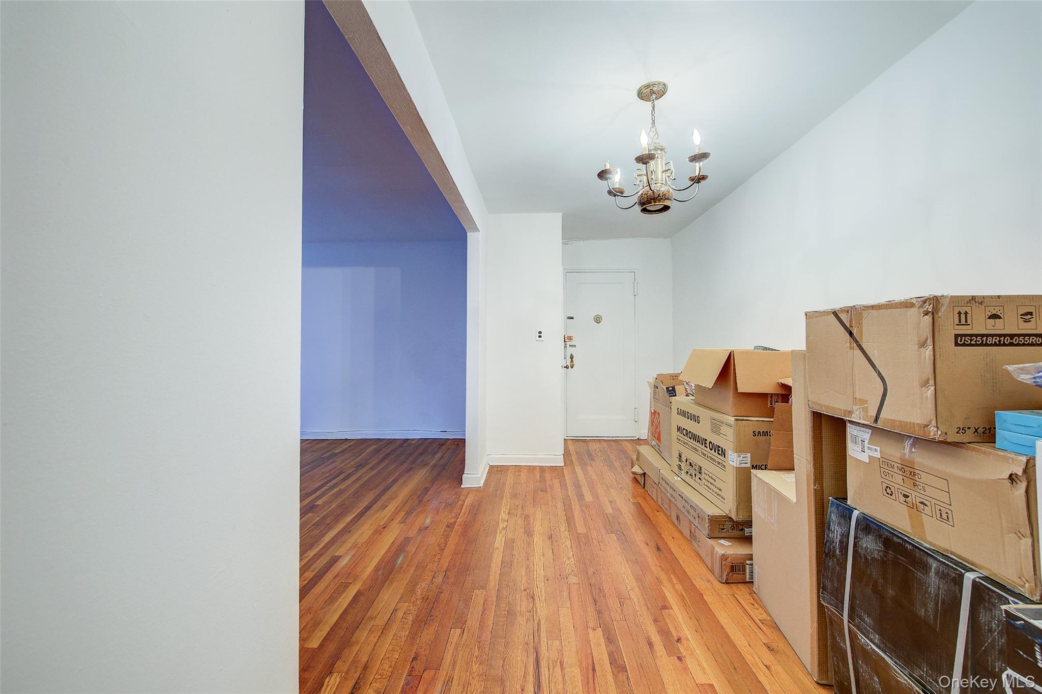 67-12 Yellowstone Boulevard, Unit D9 Queens, NY 11375 - Photo 29 of 36 a view of a livingroom with wooden floor