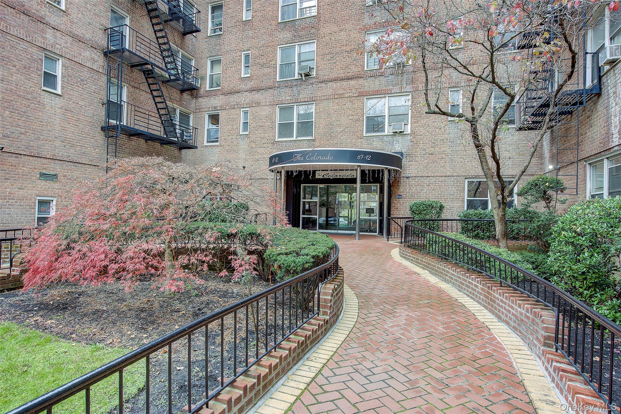 67-12 Yellowstone Boulevard, Unit D9 Queens, NY 11375 - Photo 36 of 36 a view of a garden with pathway