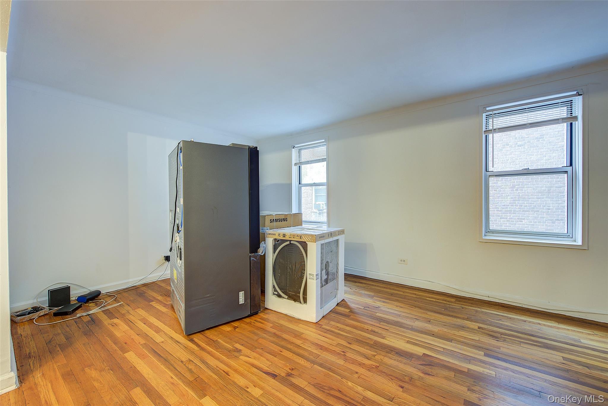 67-12 Yellowstone Boulevard, Unit D9 Queens, NY 11375 - Photo 8 of 36 a view of a room with wooden floor and closet