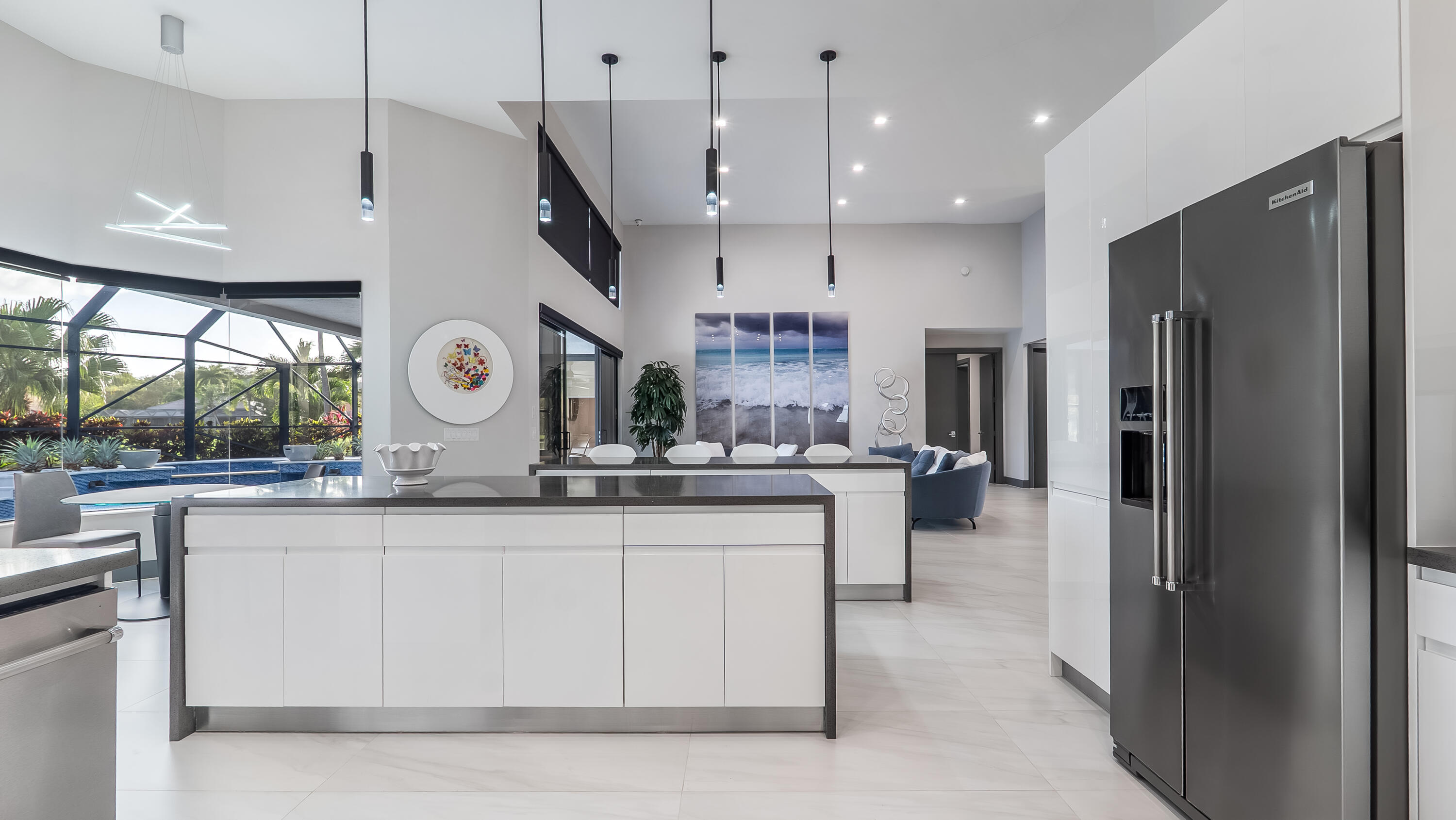 17683 Sealakes Drive Boca Raton, FL 33498 - Photo 22 of 61 a kitchen with stainless steel appliances granite countertop a sink a stove and a refrigerator