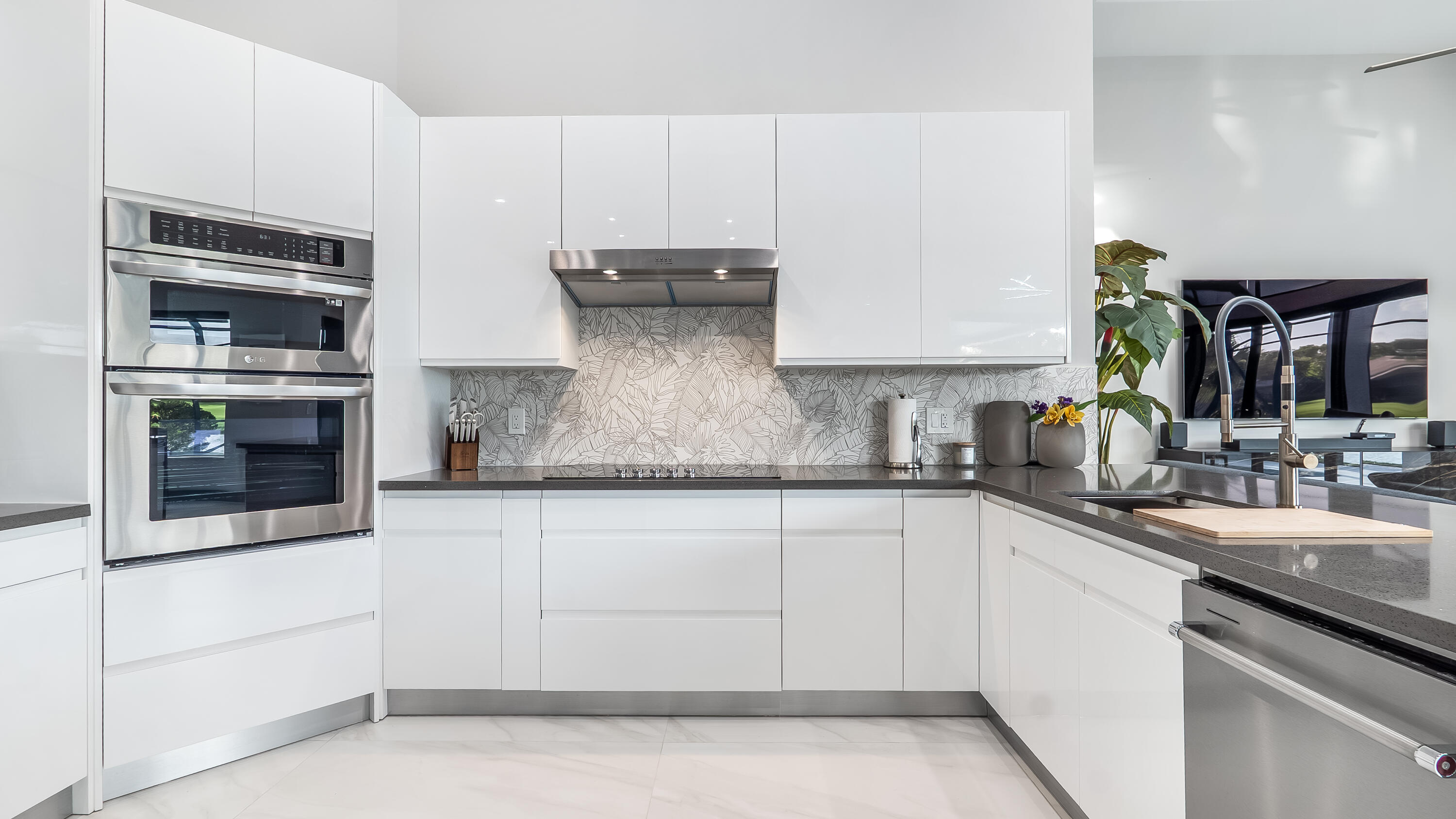 17683 Sealakes Drive Boca Raton, FL 33498 - Photo 24 of 61 a kitchen with stainless steel appliances granite countertop a sink and stove