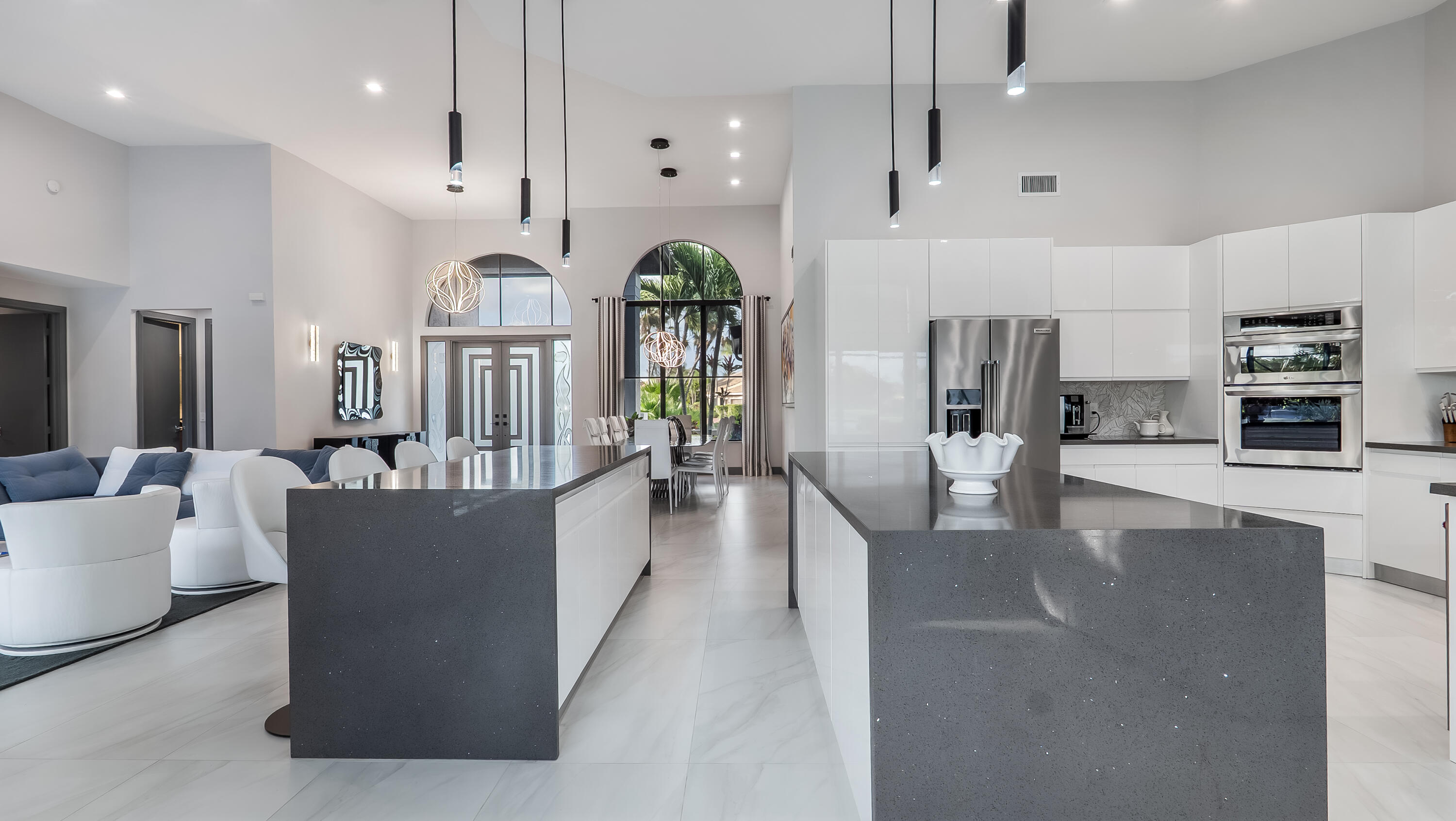 17683 Sealakes Drive Boca Raton, FL 33498 - Photo 25 of 61 a living room with stainless steel appliances furniture a rug kitchen view and a chandelier