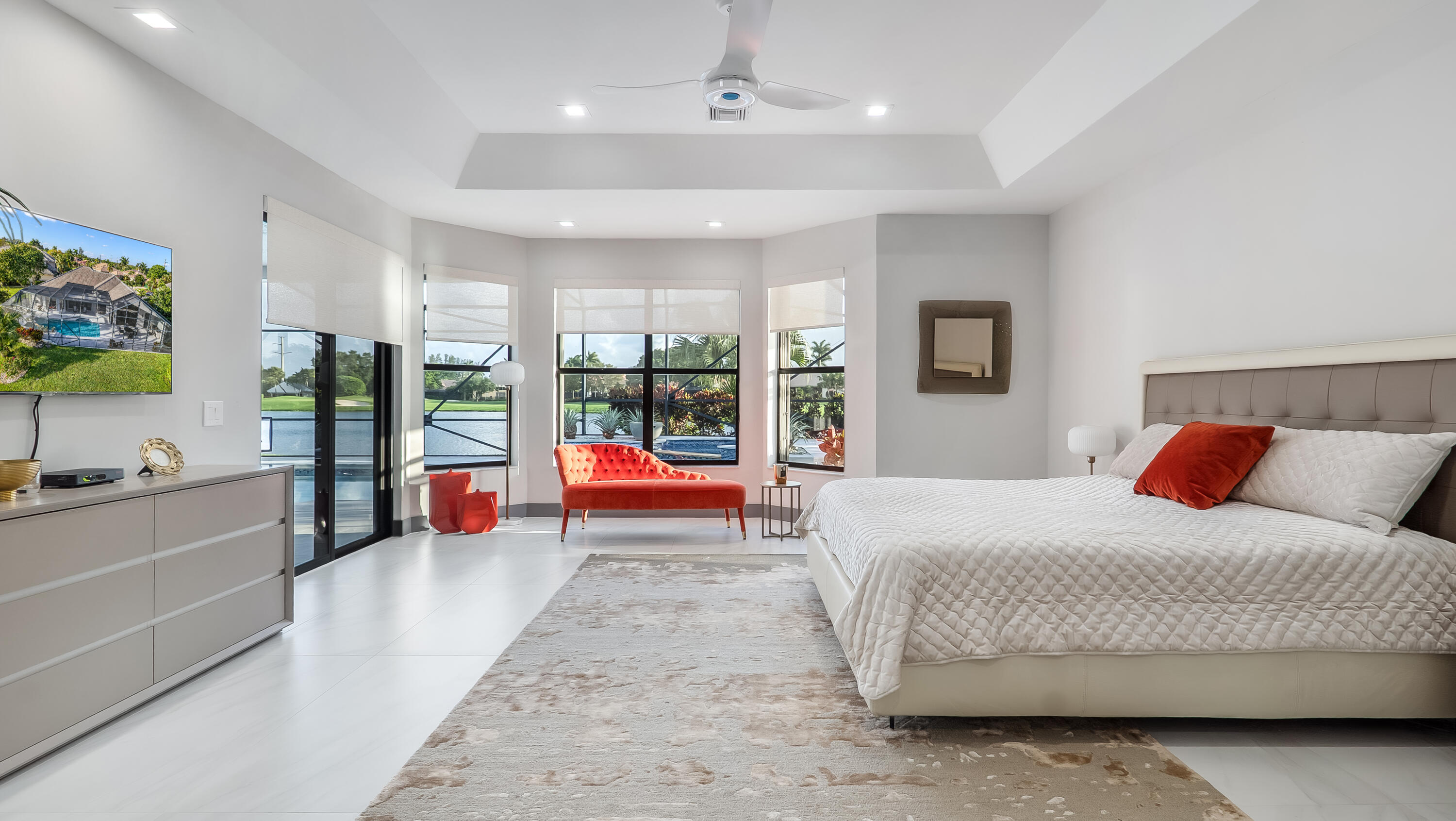 17683 Sealakes Drive Boca Raton, FL 33498 - Photo 27 of 61 a spacious bedroom with a large bed and a chandelier