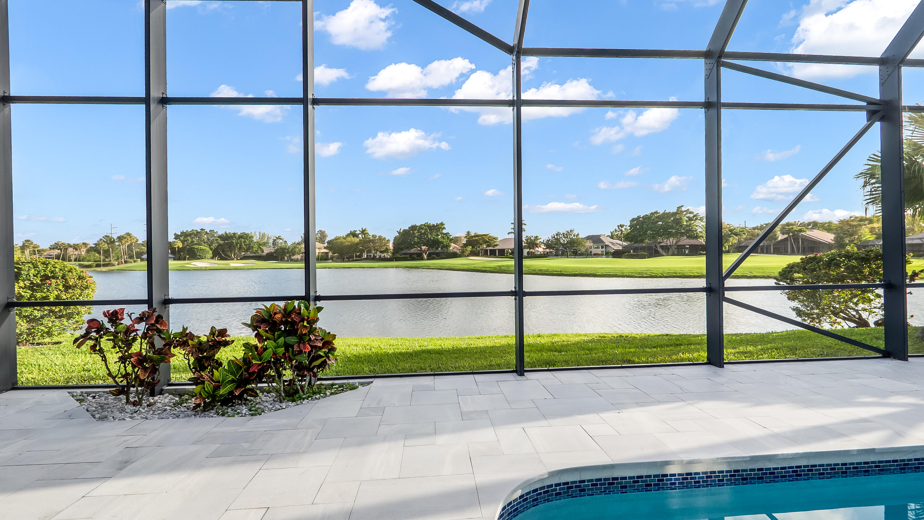 17683 Sealakes Drive Boca Raton, FL 33498 - Photo 4 of 61 a view of a street with a big yard